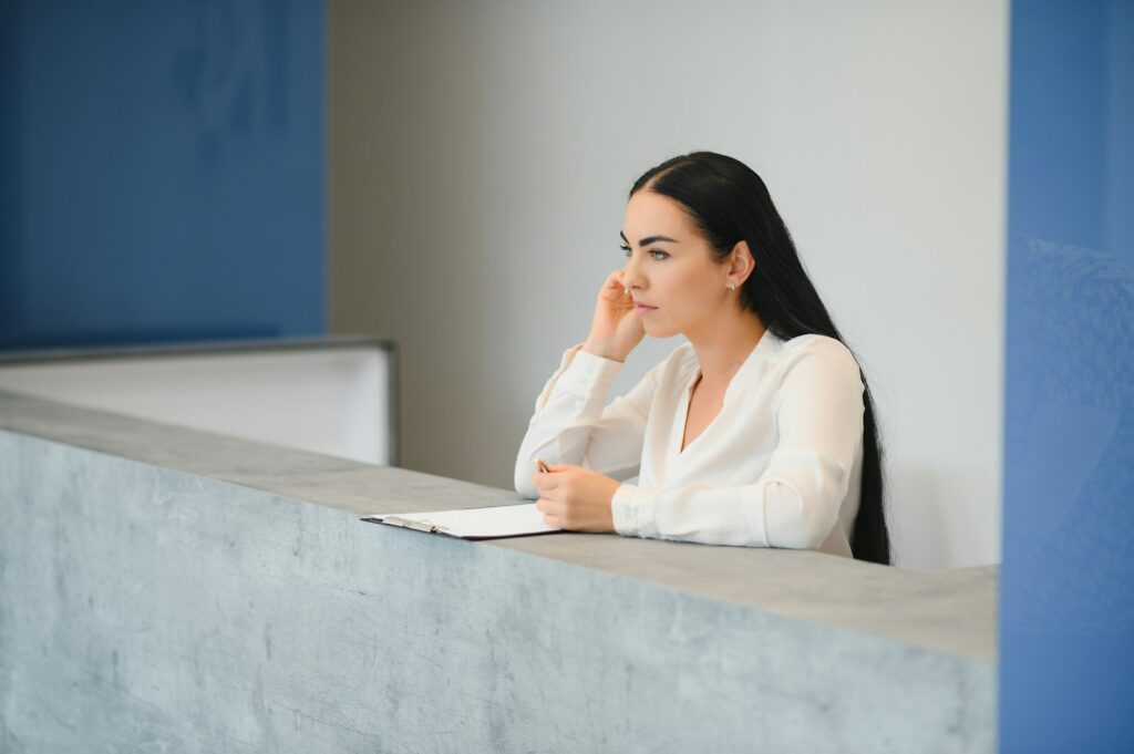 smiling businesswoman at the reception.