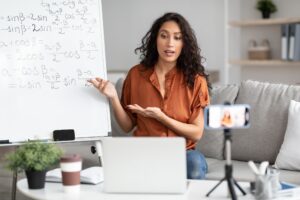 Math teacher giving virtual lecture to students