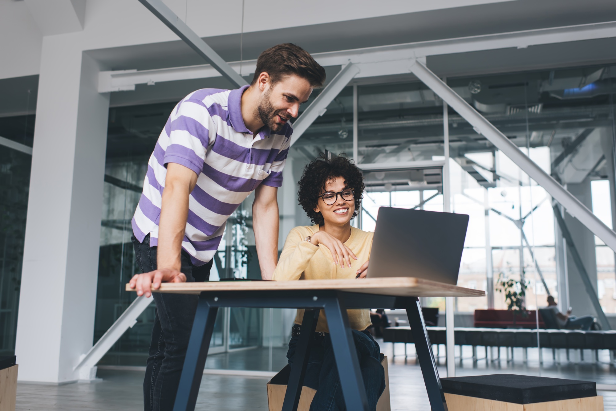 Millenial business man and woman working in office