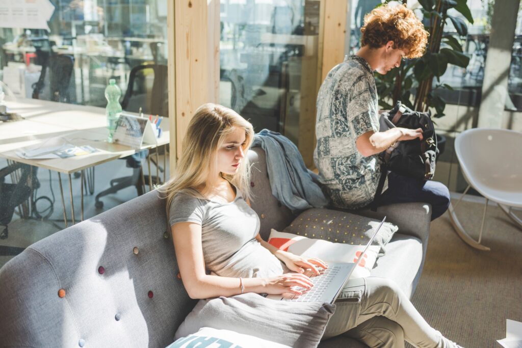 Colleagues relaxing in a sunny office lounge area