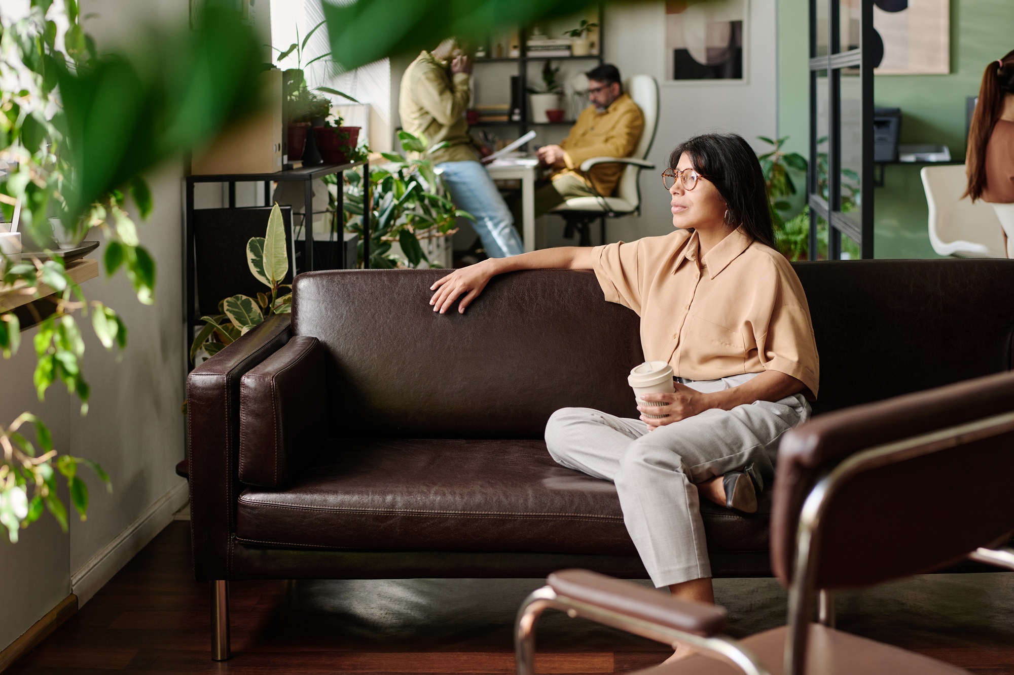 Relaxed Office Setting with Employees Engaging in Tasks