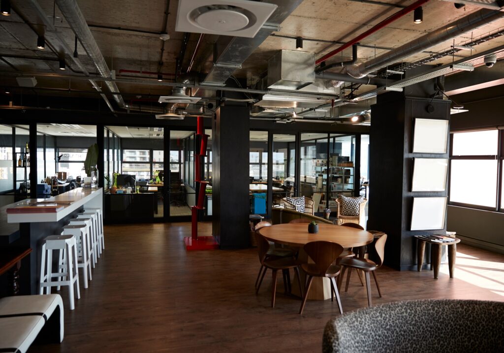 Bar and dining area in the office of a creative business, in daylight, no people