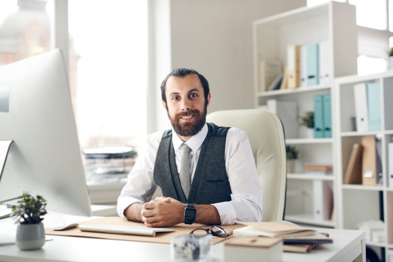 Stylish handsome executive in office